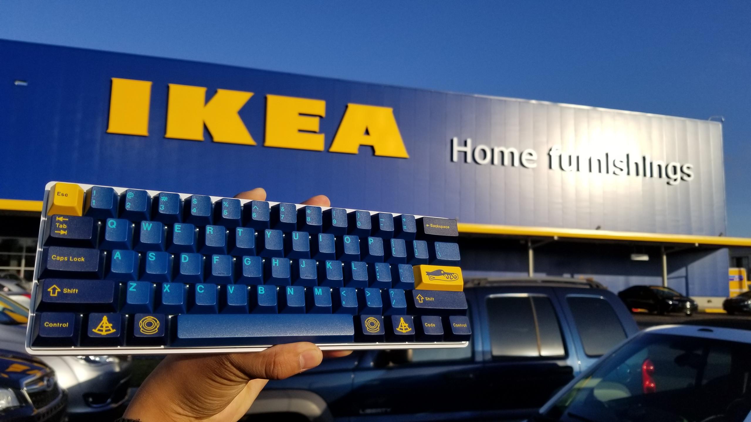 GMK Ikea keycaps on a keyboard with an Ikea store on the background