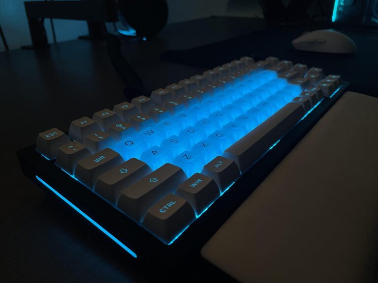 low lighting on dark keyboard with some ice blue keycaps